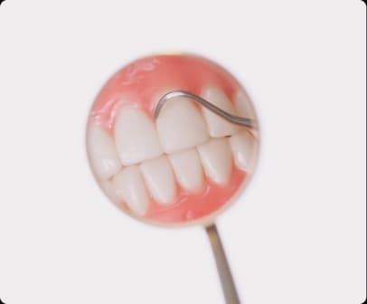Dentist checking tooth shade with a mirror